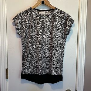 Leopard print short sleeve blouse with black banded waist. Great condition!